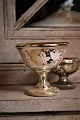 Antique, 19th 
century bowl on 
foot in Mercury 
glass "poor 
man's silver" 
decorated with 
vine ...