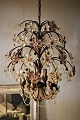 Decorative, old French chandelier with lots of fine glass flowers in clear and violet colour. ...