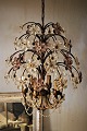 Decorative, old 
French 
chandelier with 
lots of fine 
glass flowers 
in clear and 
violet colour. 
...
