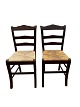 Two French chairs in dark wood with patina with a wicker seat.Measurements in cm: H:87 W:40 ...