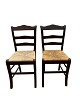 Two French 
chairs in dark 
wood with 
patina with a 
wicker seat.
Measurements 
in cm: H:87 
W:40 ...