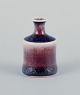 Stig Lindberg (1916-1982), Gustavsberg - Studio Hand, miniature vase with glaze 
in blue and red tones.