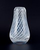 Skandinavian 
glass artist. 
Mouth-blown art 
glass vase in 
clear glass 
designed with 
white ...