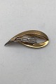 Viggo Wollny 14 
K Gold Brooch 
with Diamonds 
Measures 5.3 cm 
x 2.2 cm (2.08 
inch x 0.86 
inch) ...