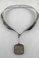 Georg Jensen 
Sterling Silver 
Torun Neck Ring 
No. 160 and 
Torun Pendant 
(No. 132)  
Measures 12.3 
...