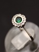 8 carat white 
gold ring size 
53 with green 
stone 
surrounded by 
clear stones 
item no. 537215