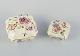 Zsolnay, 
Hungary, two 
lidded jars in 
porcelain 
hand-painted 
with flower 
motifs and 
insects on a 
...