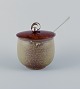 European studio ceramicist and Hugo Grün, large ceramic honey jar with wooden 
lid, flower bud in plated silver.