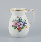 Bing & Grøndahl porcelain pitcher decorated with polychrome flowers and handle 
in the form of a seahorse.