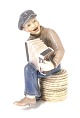 Dahl Jensen. Harmonica playing boy. Model # 1154. Height 22 cm. (1 quality)
