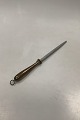 Georg Jensen 
Henning Koppel 
Brass knife 
shapener
Measures 31cm 
/ 12.20 inch