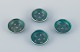 Wilhelm Kåge 
for 
Gustavsberg, a 
set of four 
small Argenta 
ceramic bowls 
inlaid with 
silver leaf ...