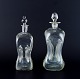 Holmegaard, Denmark.  'Cluck Cluck'  decanters in clear hand-blown glass.From the ...