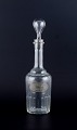 Danish 
glassworks, 
carafe for rum 
in clear 
mouth-blown 
facet-cut 
glass.
1930s/1940s.
In ...