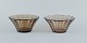 Simon Gate 
(1883-1945) for 
Orrefors/Sandvik, 
Sweden.
Two Art Deco 
bowls in smoked 
coloured ...