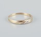 8 karat gold ring adorned with small diamonds. Modernist design.