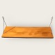 Wall-hung shelf 
in teak veneer. 
With traces of 
use. 
Dimensions: 80x 
25 cm