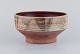 Mogens Nielsen, Nysted, Denmark, large handmade ceramic bowl decorated with 
abstract motifs. Glazed in brown tones.