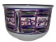 Royal 
Copenhagen art 
pottery, large 
unique round 
bowl with 
purple 
decoration.
Designed (and 
...