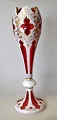 Bohemian Art Nouveau vase in red glass with white border, approx. 1900. With grindings and ...
