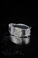 Old napkin ring 
in silver, 
stamped, with a 
motif of a boy 
riding a goat. 
W:2cm. 
O:5x3.2cm. ...