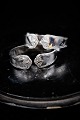 Old napkin ring 
in silver, 
stamped, with 
fine 
decorations. 
W:1,5cm. 
O:4,8x3,3cm. 
Weight:19,8 ...
