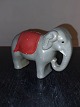 Figure of elephant with function as piggy bank. Painted gray with red deck. Appears in good ...
