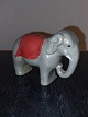 Figure of 
elephant with 
function as 
piggy bank. 
Painted gray 
with red deck. 
Appears in good 
...