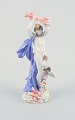 Meissen, Germany, hand-painted porcelain figurine depicting Zeus with lightning.