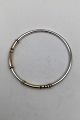 Georg Jensen / 
Hans Hansen 
Sterling Silver 
/ Gold Bangle 
Measures Diam 
6.2 cm (2.44 
inch) Weight 
...