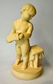 Danish artist 
(20th century): 
A boy with an 
accordion. 
Artificial 
stone. Signed: 
Monogram. ...