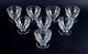 Baccarat, Frankrig, et sæt på otte ”Charmes” Art Deco rødvinsglas i klart 
krystalglas. Facetslebet.