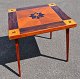 Folding Danish 
game table, 
1950s. With 
marquetry in 
the corners: 
panes, claws, 
hearts and ...