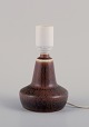 Gunnar Nylund 
for Rörstrand, 
small ceramic 
table lamp.
Glaze in brown 
tones.
Approximately 
...