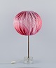 Josef Frank 
(1885–1967), 
large table 
lamp in glass 
and brass. 
Textile 
lampshade with 
pink ...