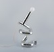 Gaetano 
Missaglia, 
Italian 
designer, Rombo 
table lamp 
composed of 
pipes in 
chrome-plated 
ABS ...