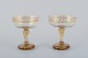 Emile Gallé (1846-1904), fransk kunstner og designer.
To champagneskåle i krystalglas hånddekoreret med blade i guld.
