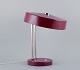 Kaiser 
Leuchten. 
Burgundy 
coloured desk 
lamp.
1960s.
In excellent 
condition.
Dimensions: 
...