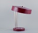 Kaiser 
Leuchten. 
Burgundy 
coloured desk 
lamp.