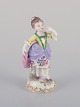 Antique German 
porcelain 
figurine. Young 
woman in 
elegant attire. 
Hand-painted in 
polychrome ...