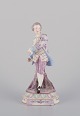 Antique German 
porcelain 
figurine. Large 
figurine of a 
young man in 
fine clothes. 
Hand-painted 
...