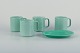 Royal 
Copenhagen, "4 
All Seasons", 
four coffee 
mugs and a 
small oval dish 
in faience with 
green ...