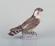 Dahl Jensen for 
Bing & 
Grøndahl. 
Porcelain 
figurine of a 
sitting 
peregrine 
falcon.
Dating from 
...