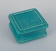 Wilhelm Kåge 
(1889-1960) for 
Gustavsberg, 
Sweden. Square 
Art Deco lidded 
box in ceramic 
with ...