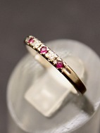 14 carat white gold ring  with diamonds and rubies