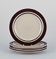 Raija Uosikkinen and Ulla Procopé for Arabia, Finland. A set of four "Ruija" 
dinner plates in stoneware with brown decoration.