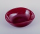 Monica Bratt 
for Reijmyre, 
Sweden. Large 
oval bowl in 
mouth-blown 
wine red art 
...
