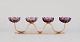 Gunnar Ander for Ystad Metall, Sweden.
Four-armed candle holder in brass with purple art glass shaped like flowers.