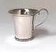 Grann & Laglye. 
Silver 
children's mug 
(830). Height 
6.5 cm. 
Produced 1947.