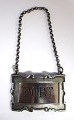 Silver wine 
label (830). 
Port. Width 5,5 
cm.